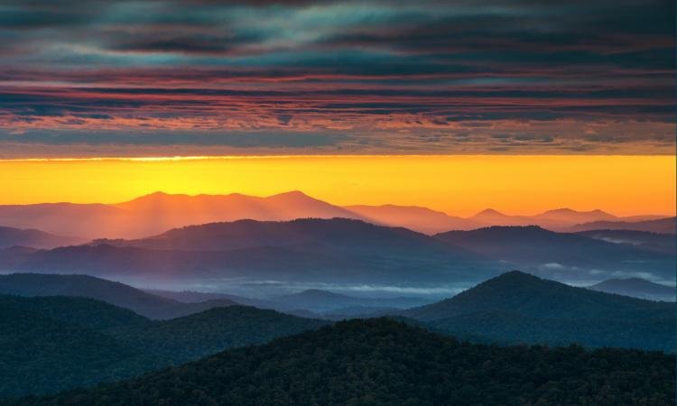 sunset over the mountains in asheville north carolina