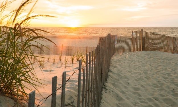 dunes and waves at the oceanfront in Bethany Beach, Delaware