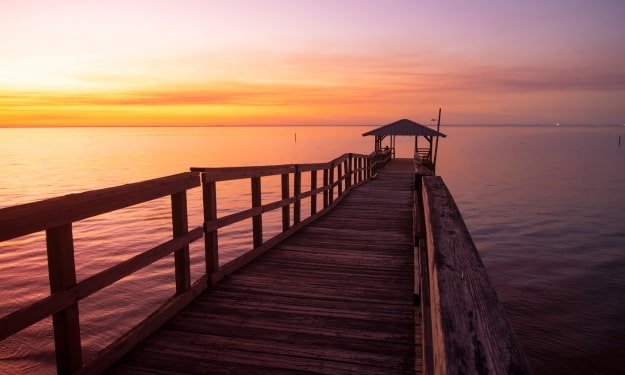 waterfront pier in Fairhope, Alabama at sunset