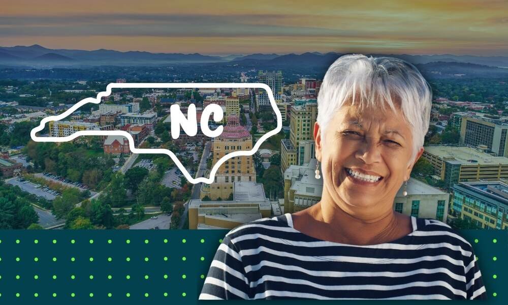 happy retiree with north carolina city in background