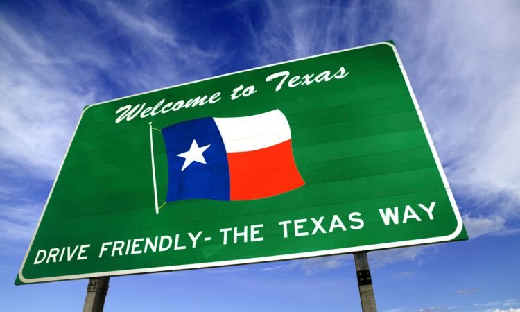 roadside sign welcoming newcomers to texas