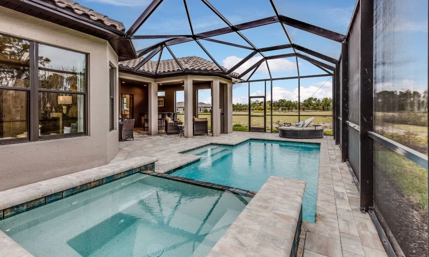 a screened-in pool attached to a florida new construction home