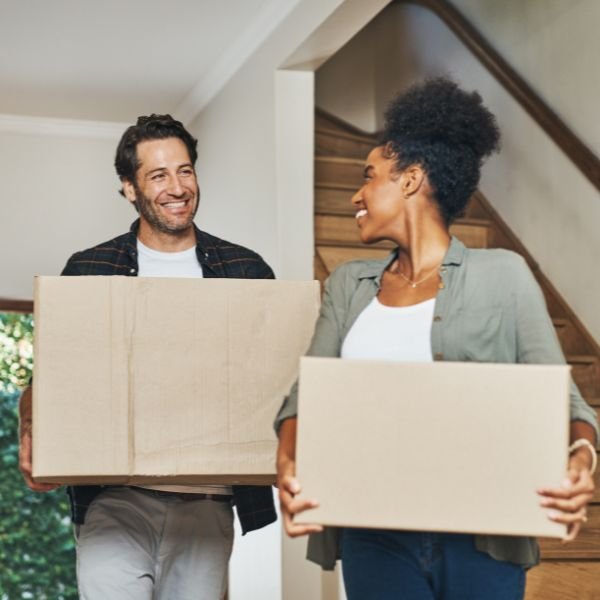 happy people moving their things as they relocate to a new city